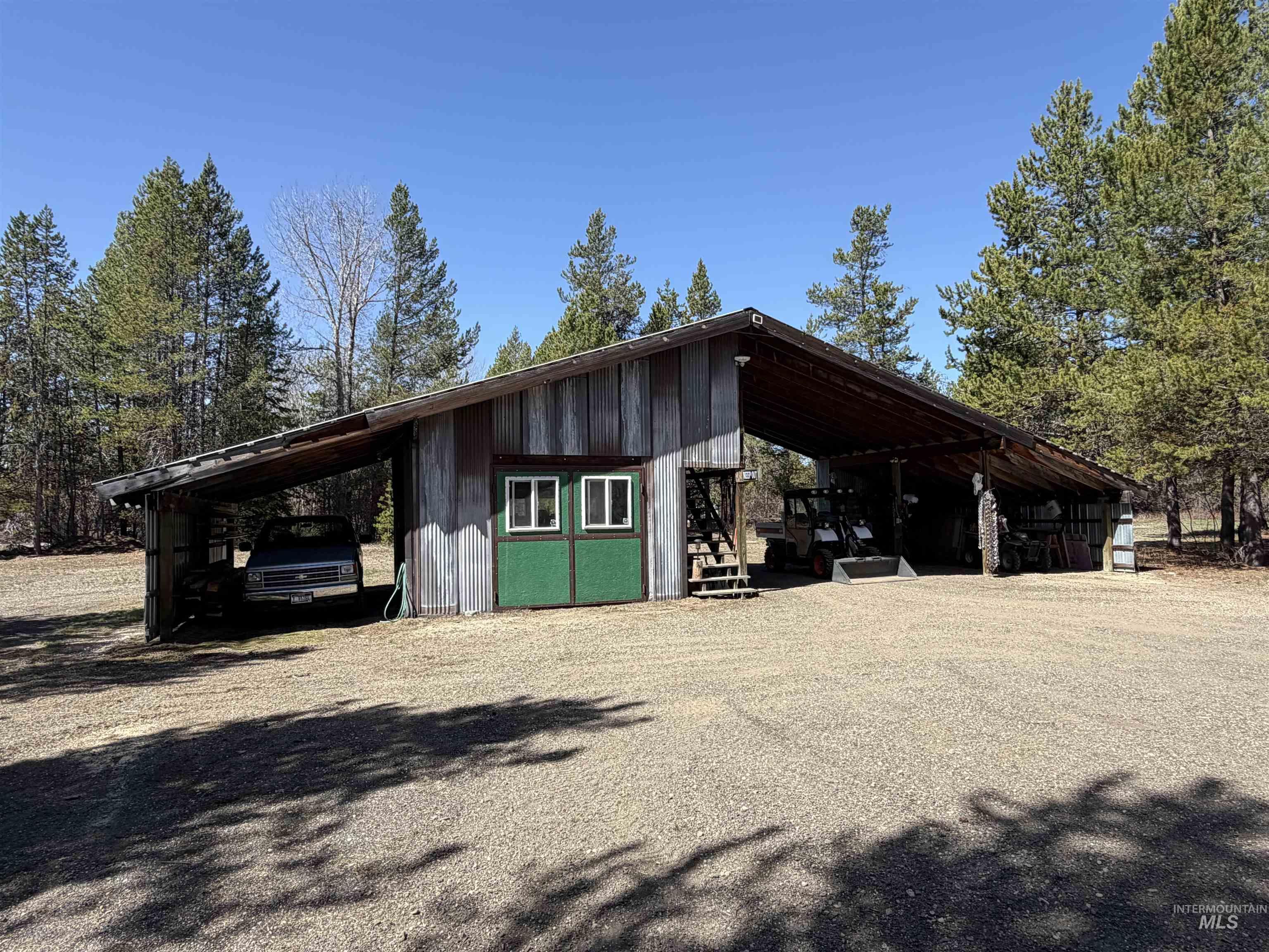 Expansive outbuilding with a corrugated metal roof and wood paneling