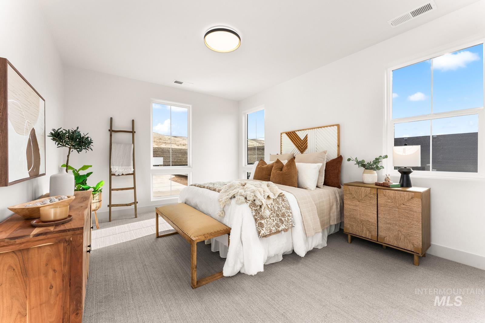 Carpeted bedroom with baseboards