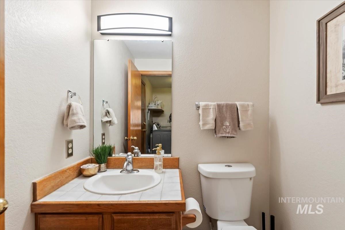 Bathroom featuring vanity and a textured wall