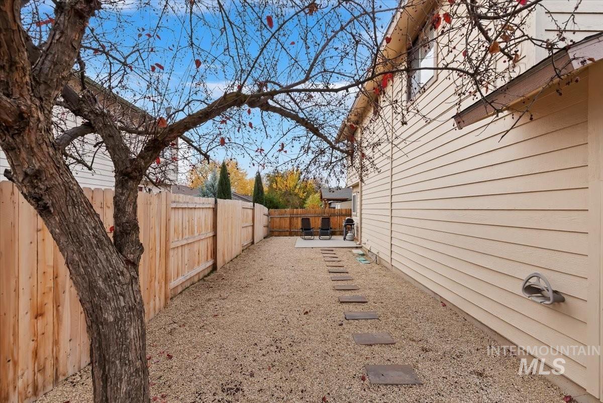 Fenced backyard with a patio area