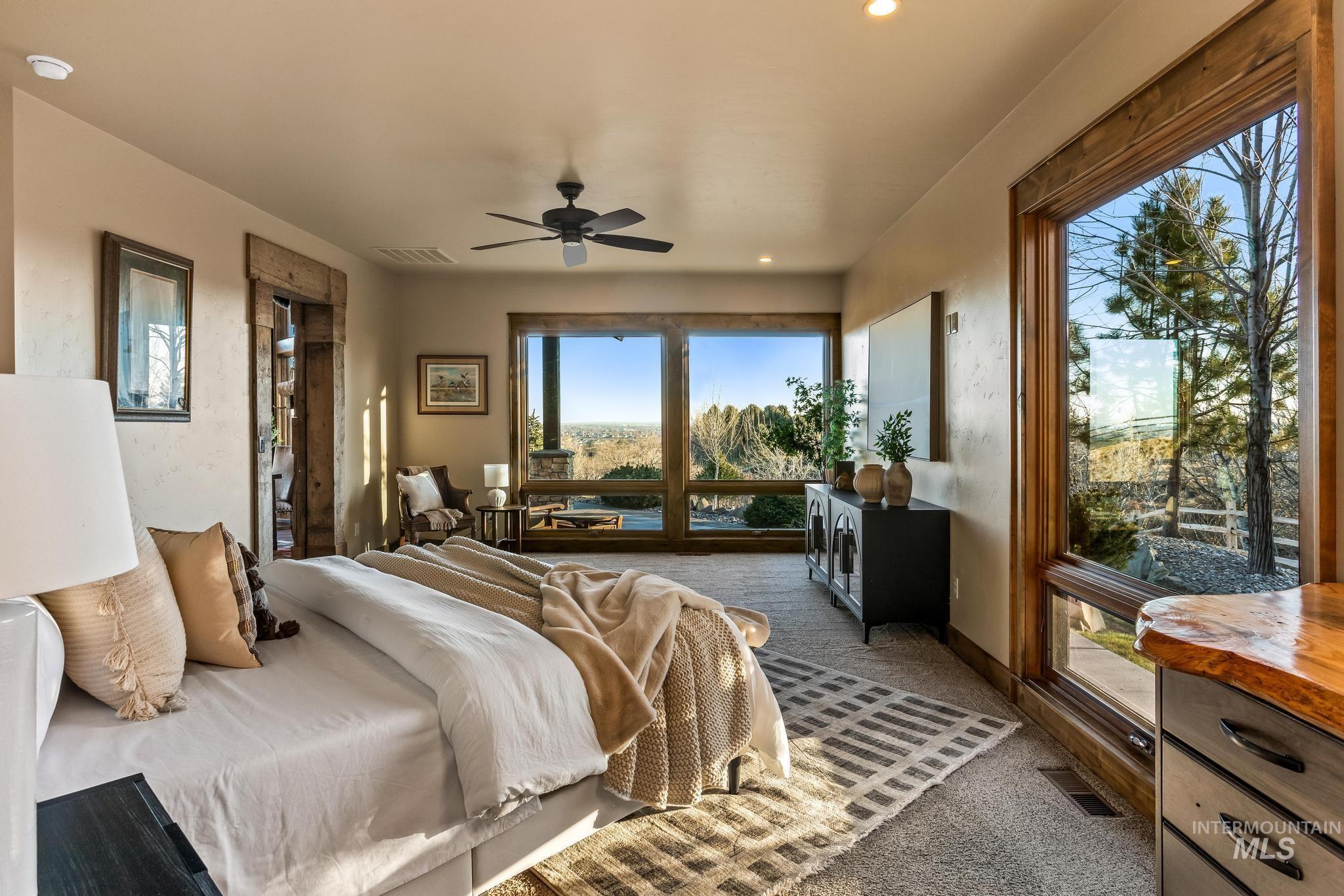Bedroom with recessed lighting, ceiling fan, extensive windows