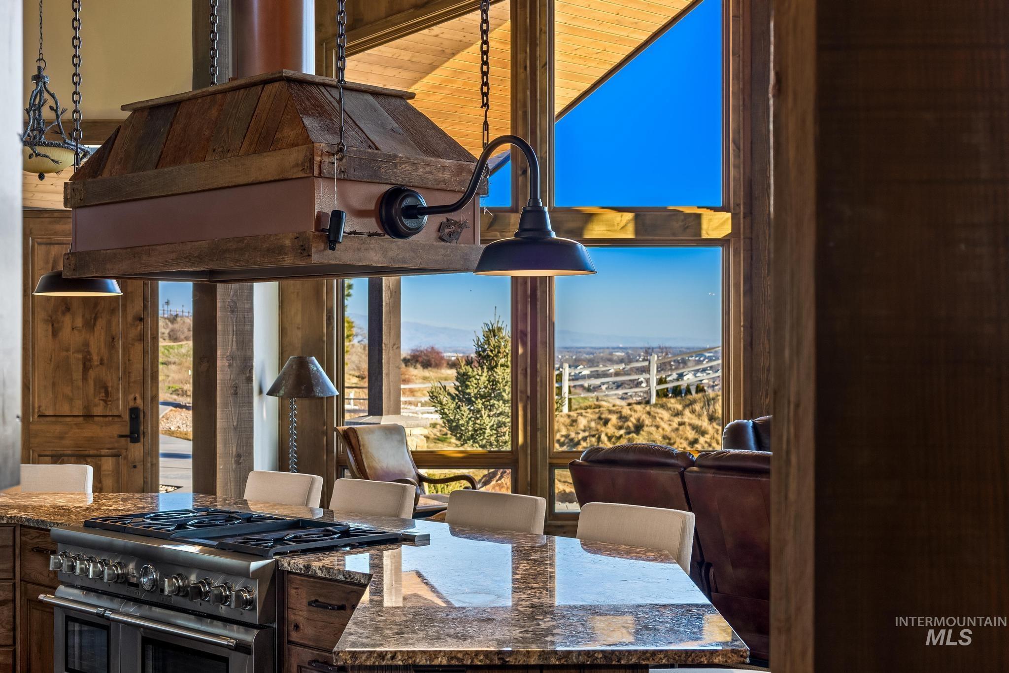 Kitchen island with view out the Great Room windows to the valley below
