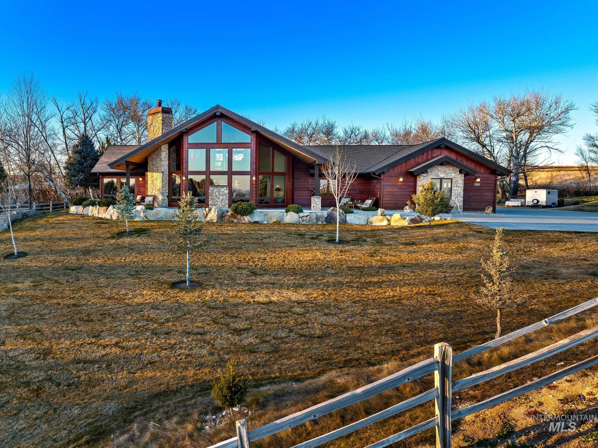 View of front of property and lawn