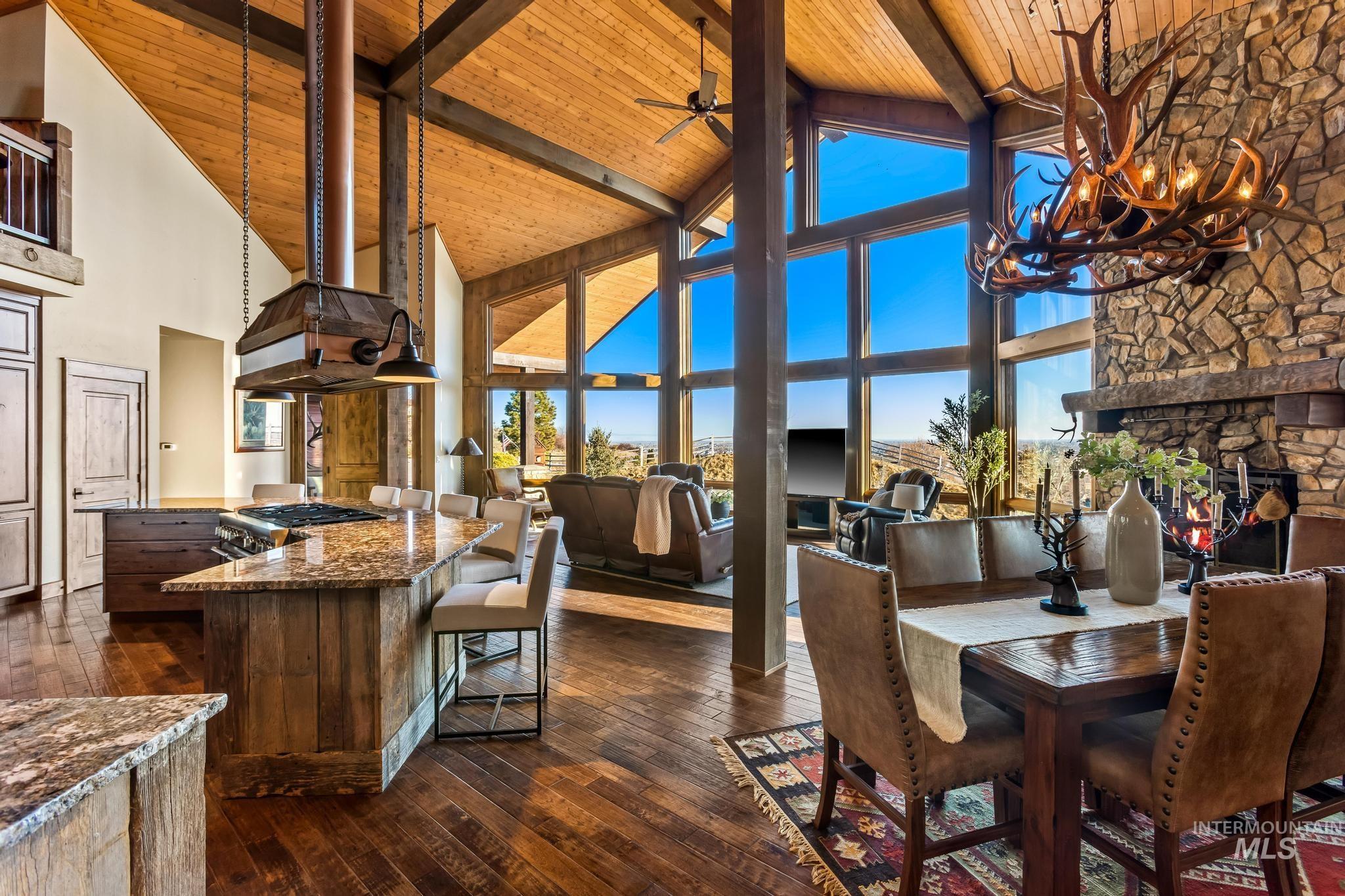 Great Room view of Dining, Kitchen and fireplace