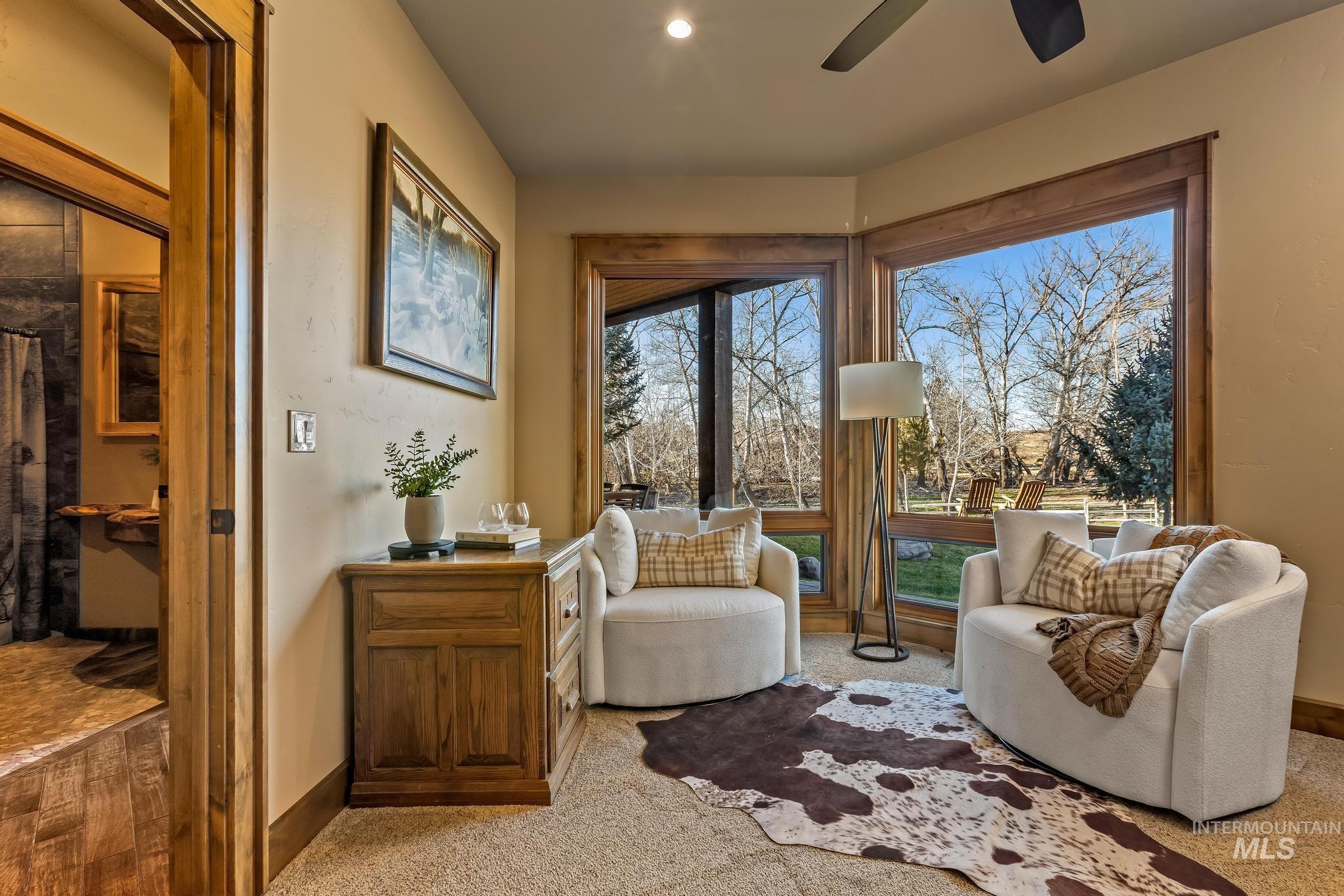 Office or 3rd bedroom with expansive windows, recessed lighting and ceiling fan