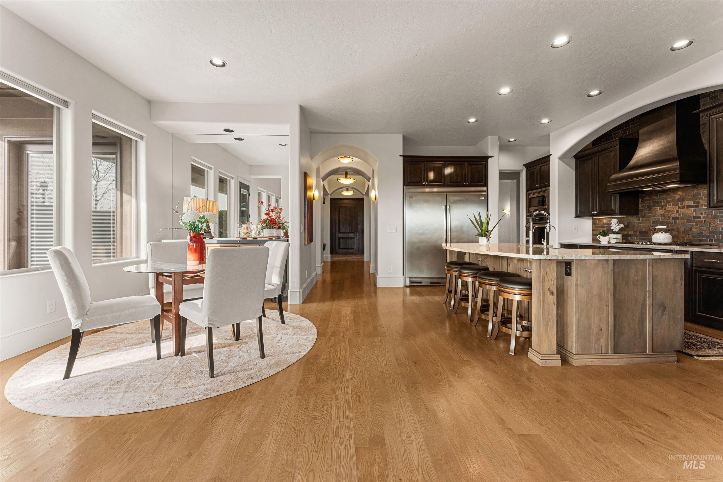 Dining room with recessed lighting and light wood-style floors
