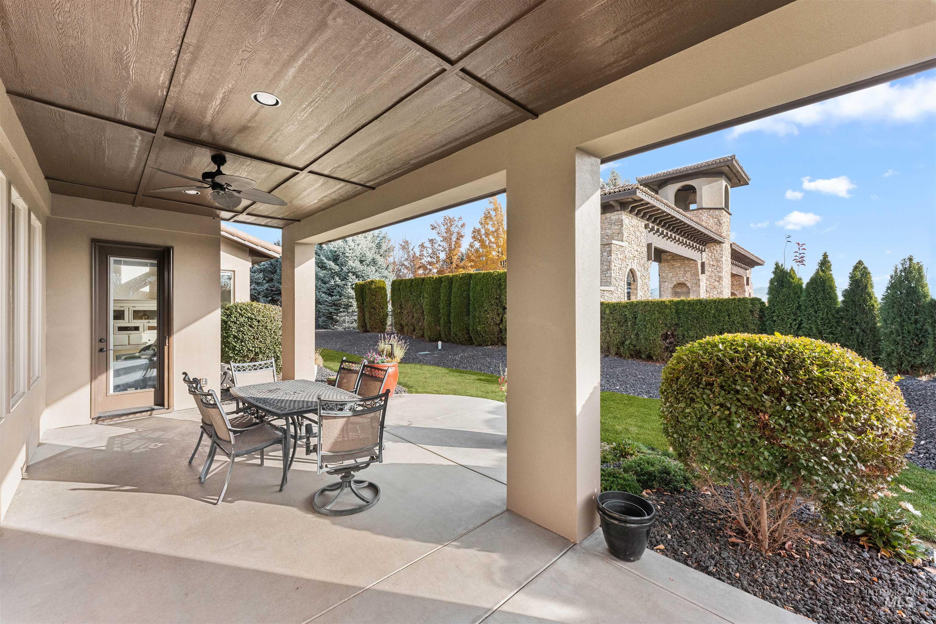 View of patio featuring a ceiling fan and outdoor dining area
