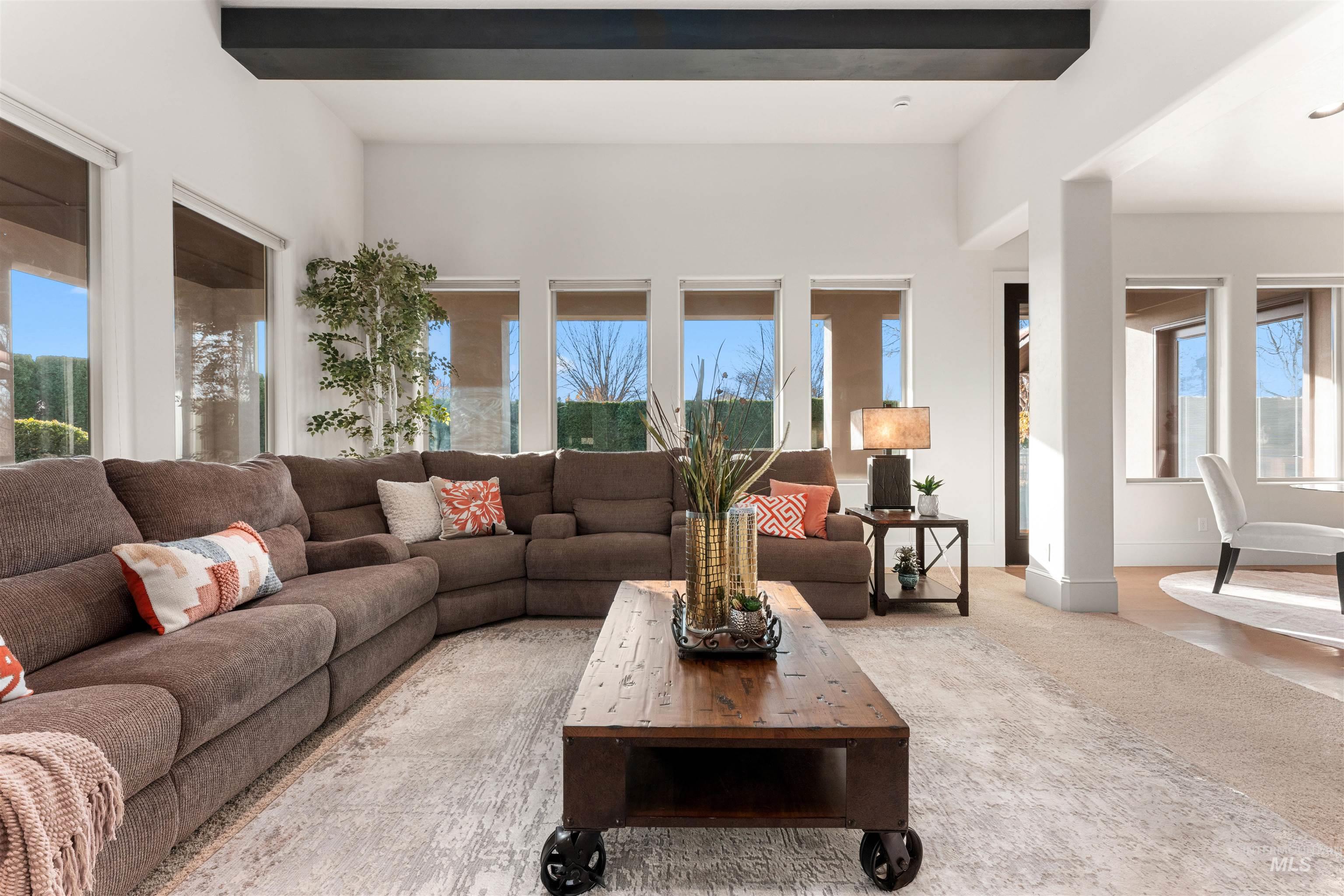 Carpeted living area with baseboards