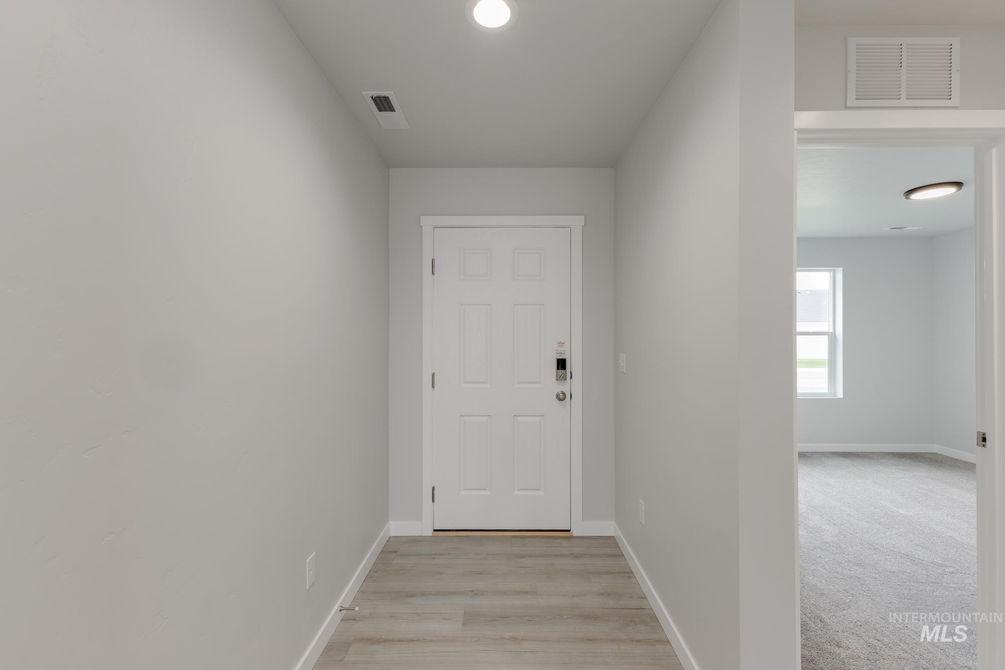 Hall featuring recessed lighting and light wood-type flooring