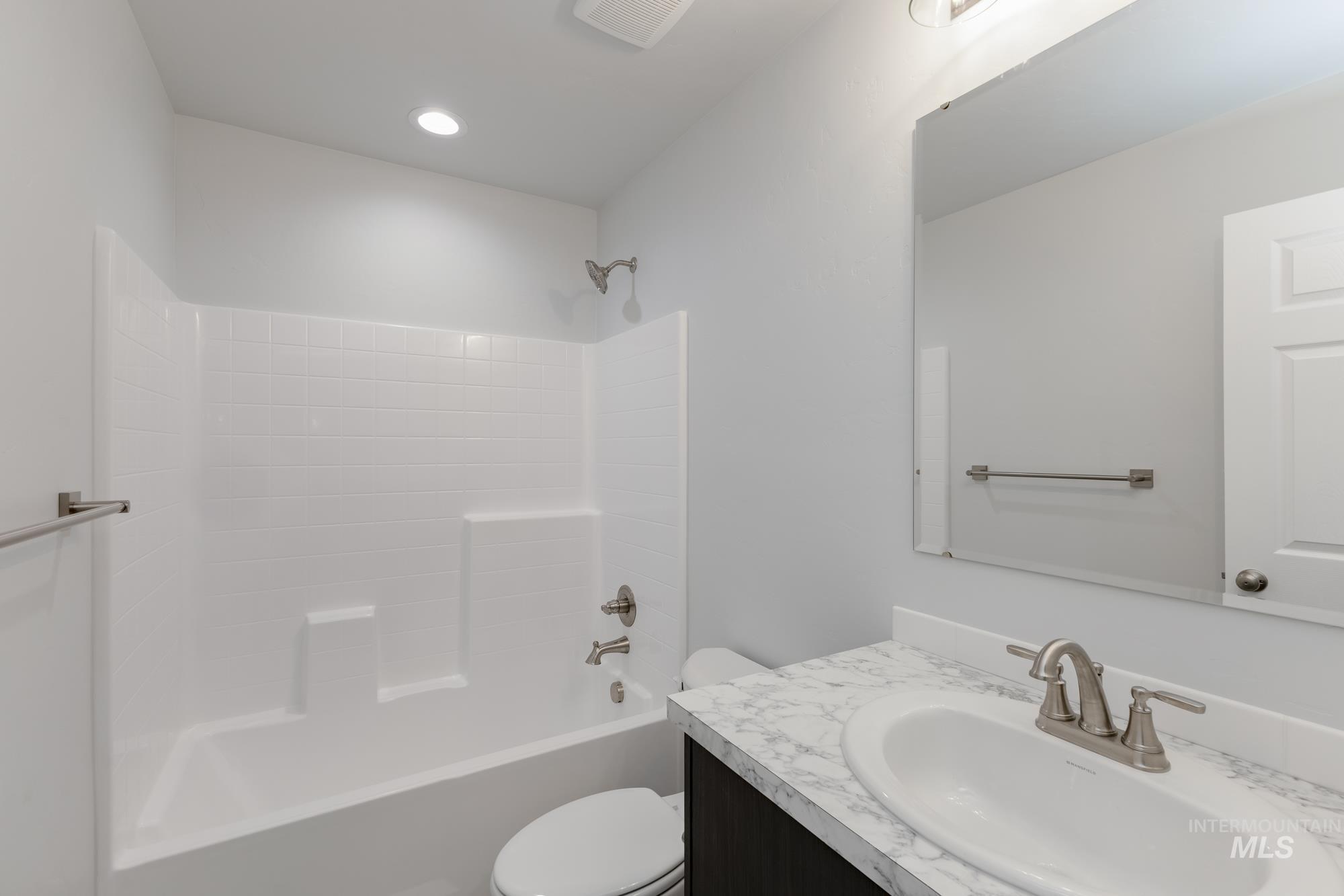 Bathroom featuring vanity and tub / shower combination