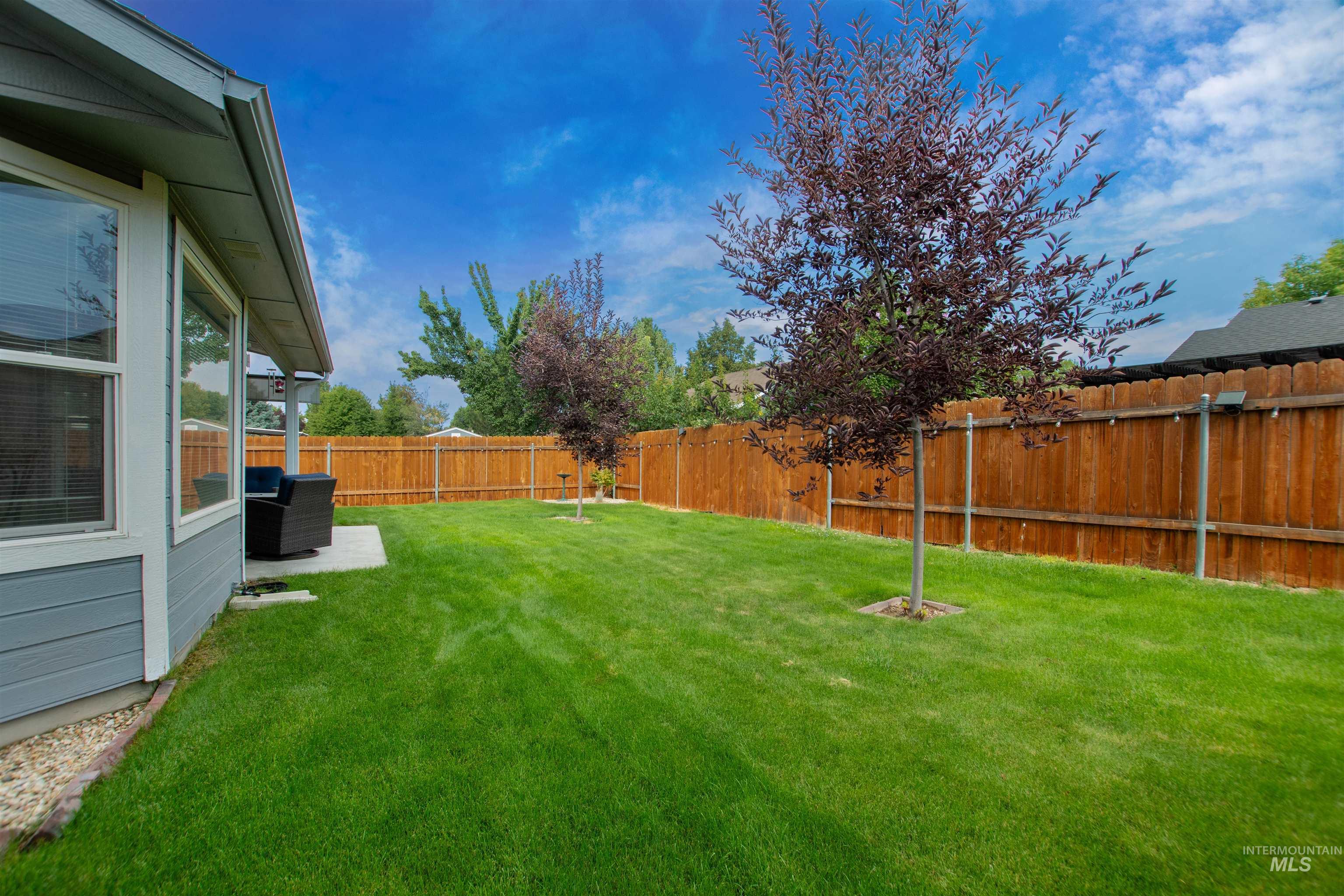 View of fenced backyard