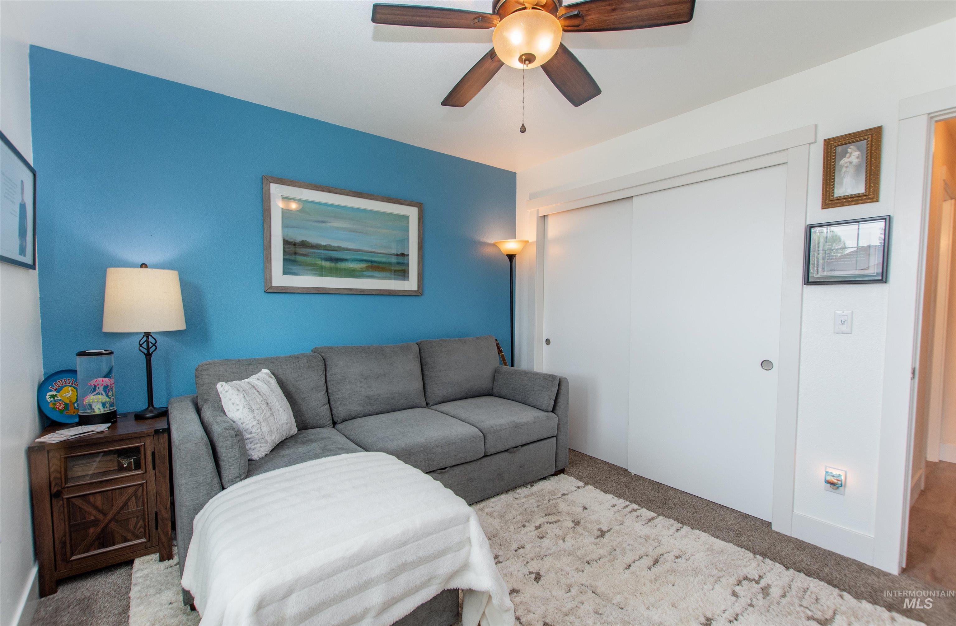 Bedroom with carpet floors and ceiling fan