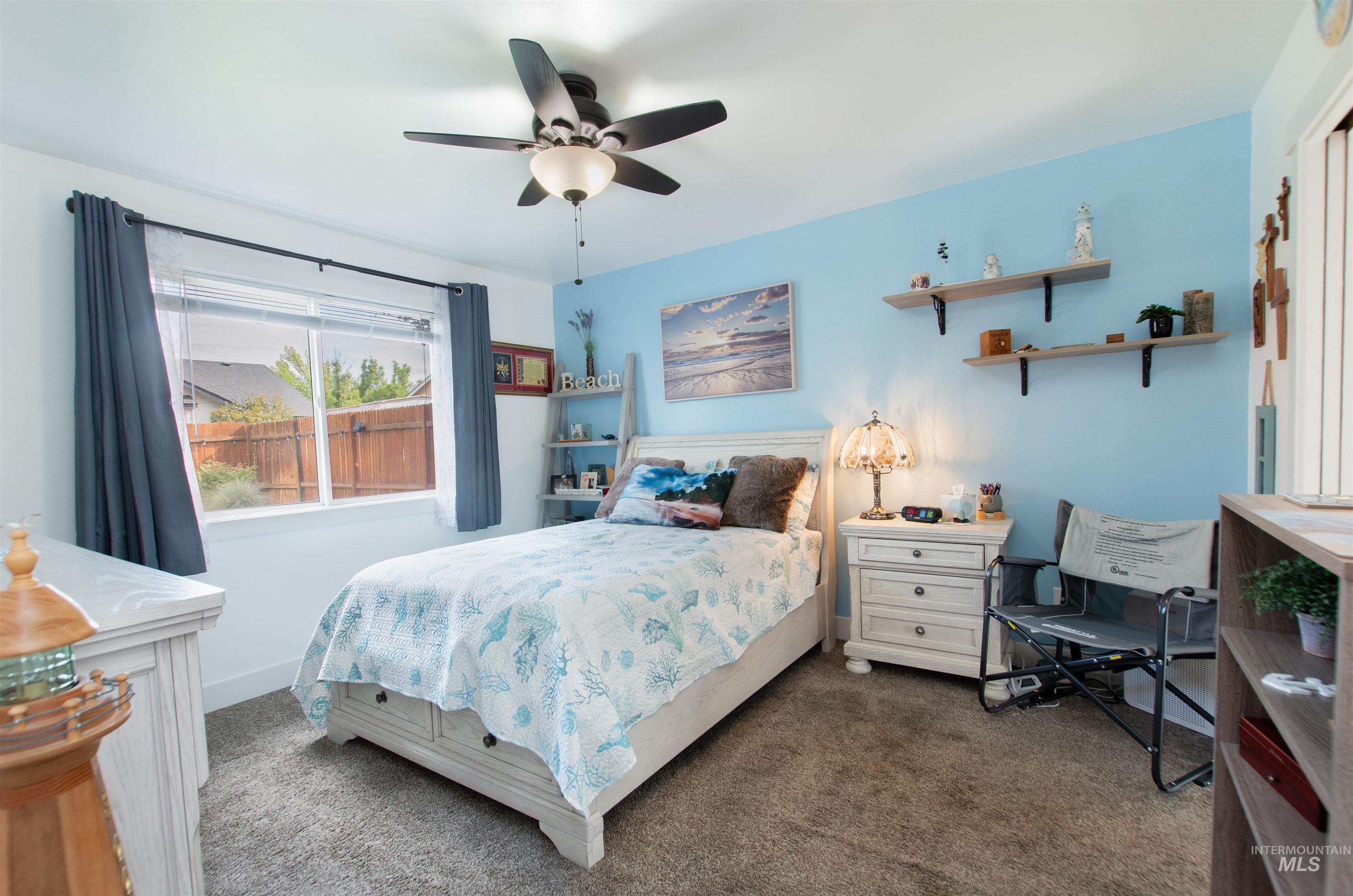 Bedroom featuring carpet and a ceiling fan