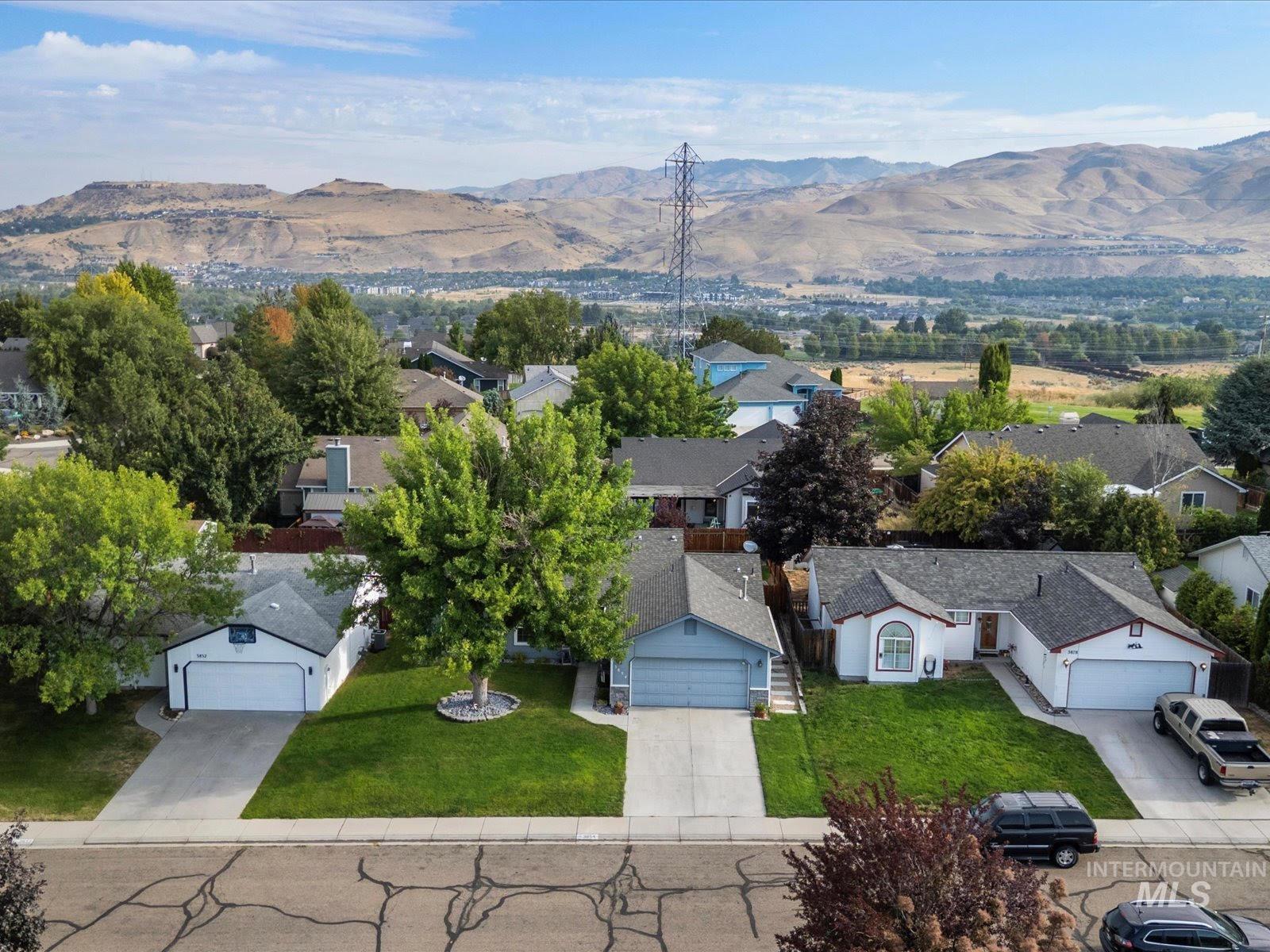 Aerial view of residential area with a mountainous background