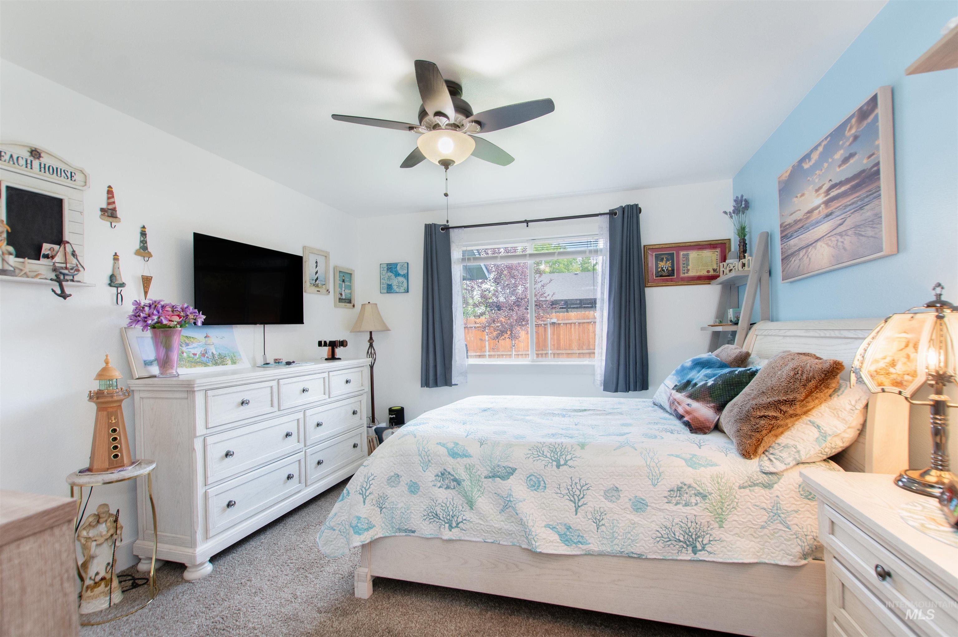 Bedroom with carpet floors and ceiling fan