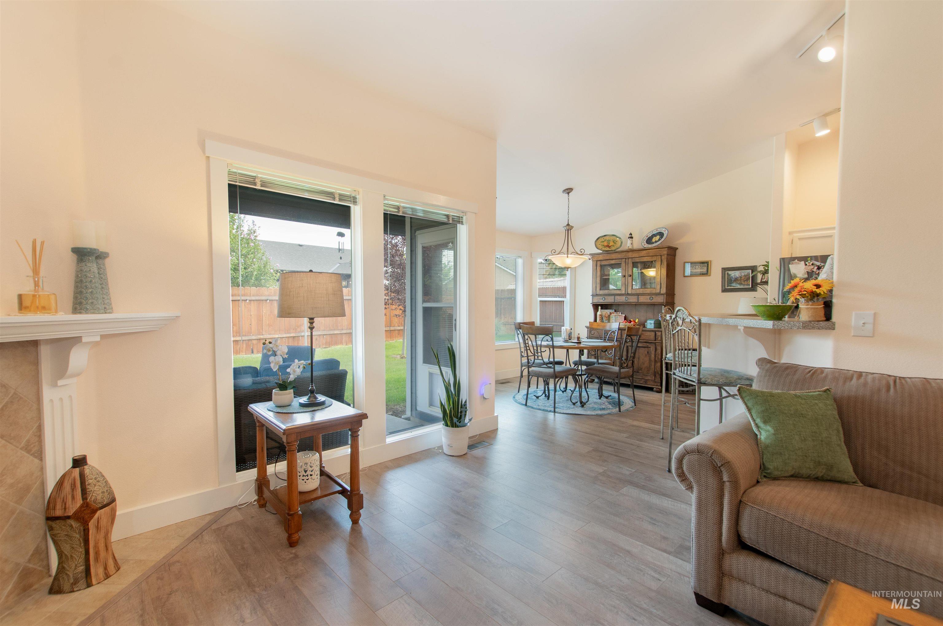 Living area featuring wood finished floors and lofted ceiling