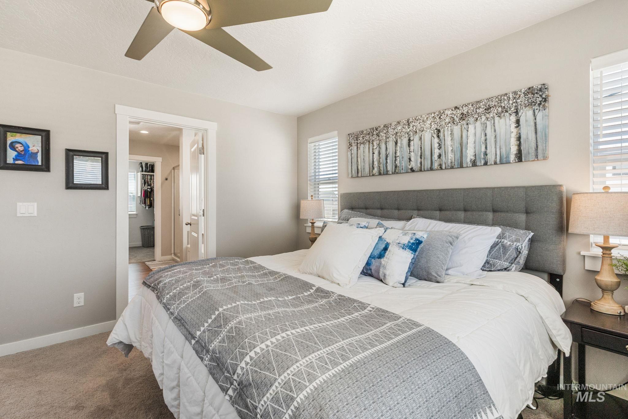 Bedroom with carpet and ceiling fan