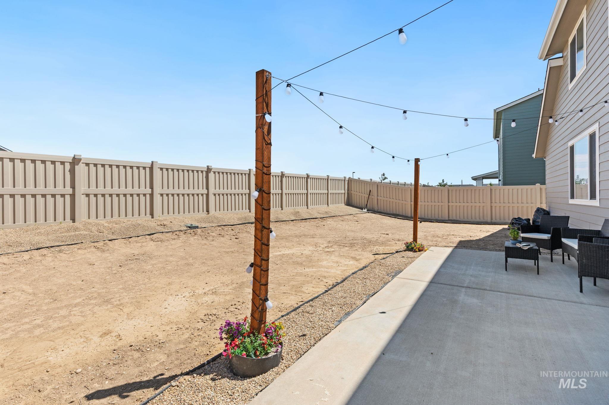 Fenced backyard featuring a patio