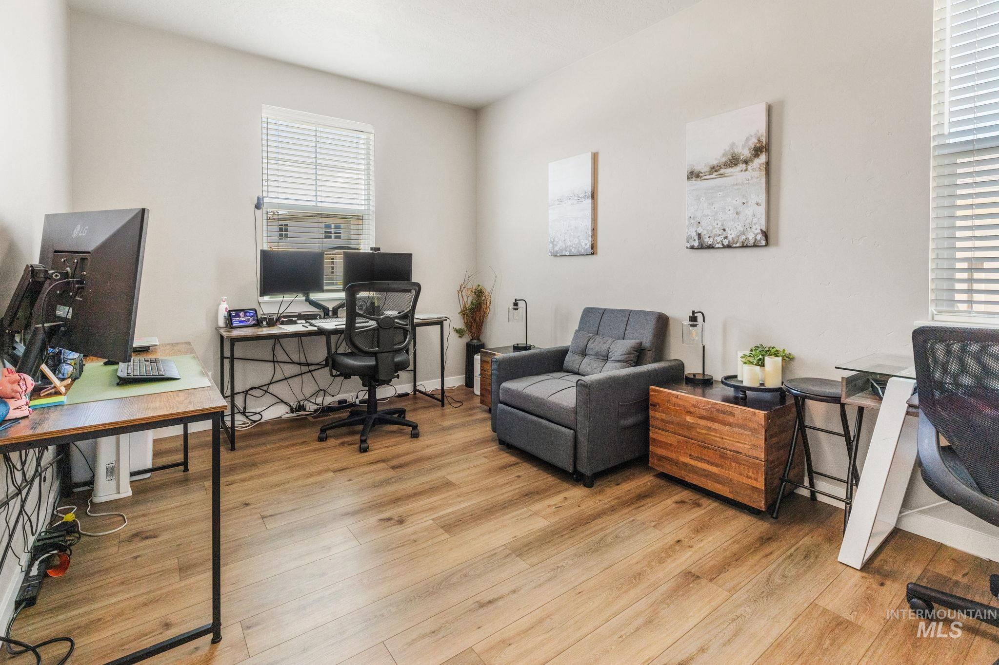 Office area featuring wood finished floors