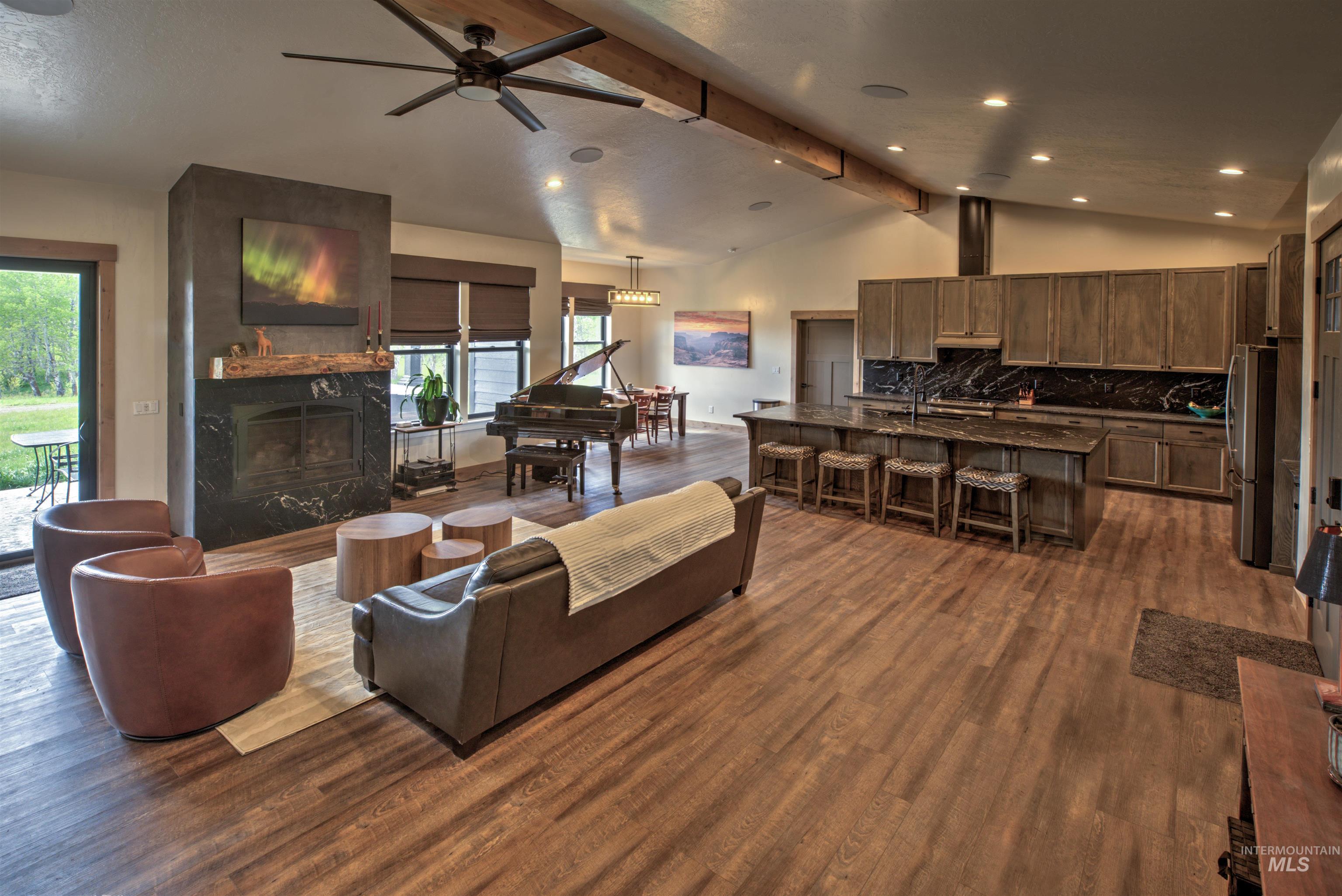 Vaulted ceilings with exposed wood beams in this open-concept living space