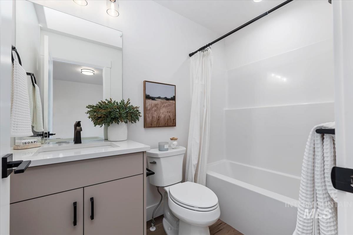 Full bathroom with vanity and shower / tub combo