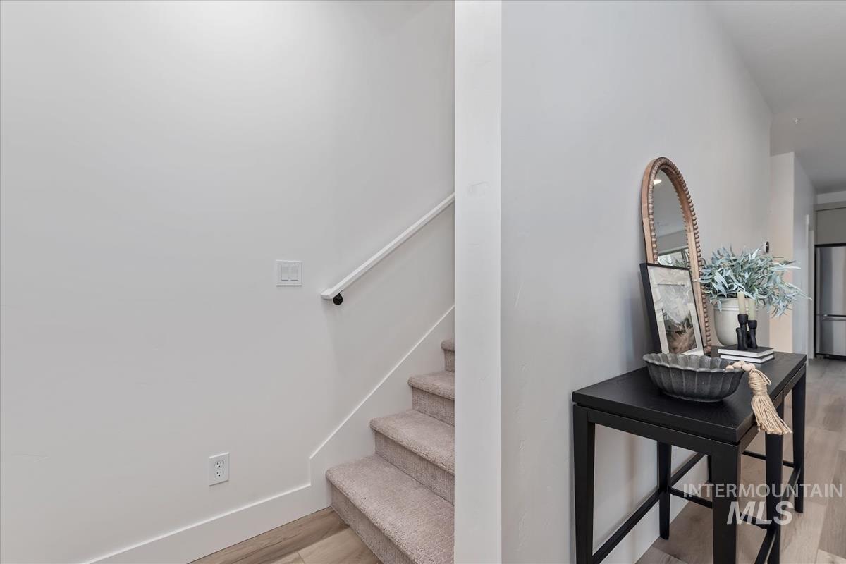 Staircase with wood finished floors