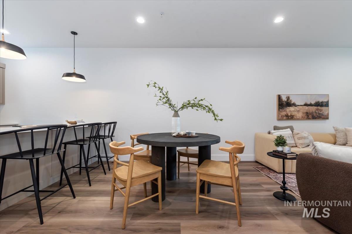 Dining space featuring light wood-style floors and recessed lighting