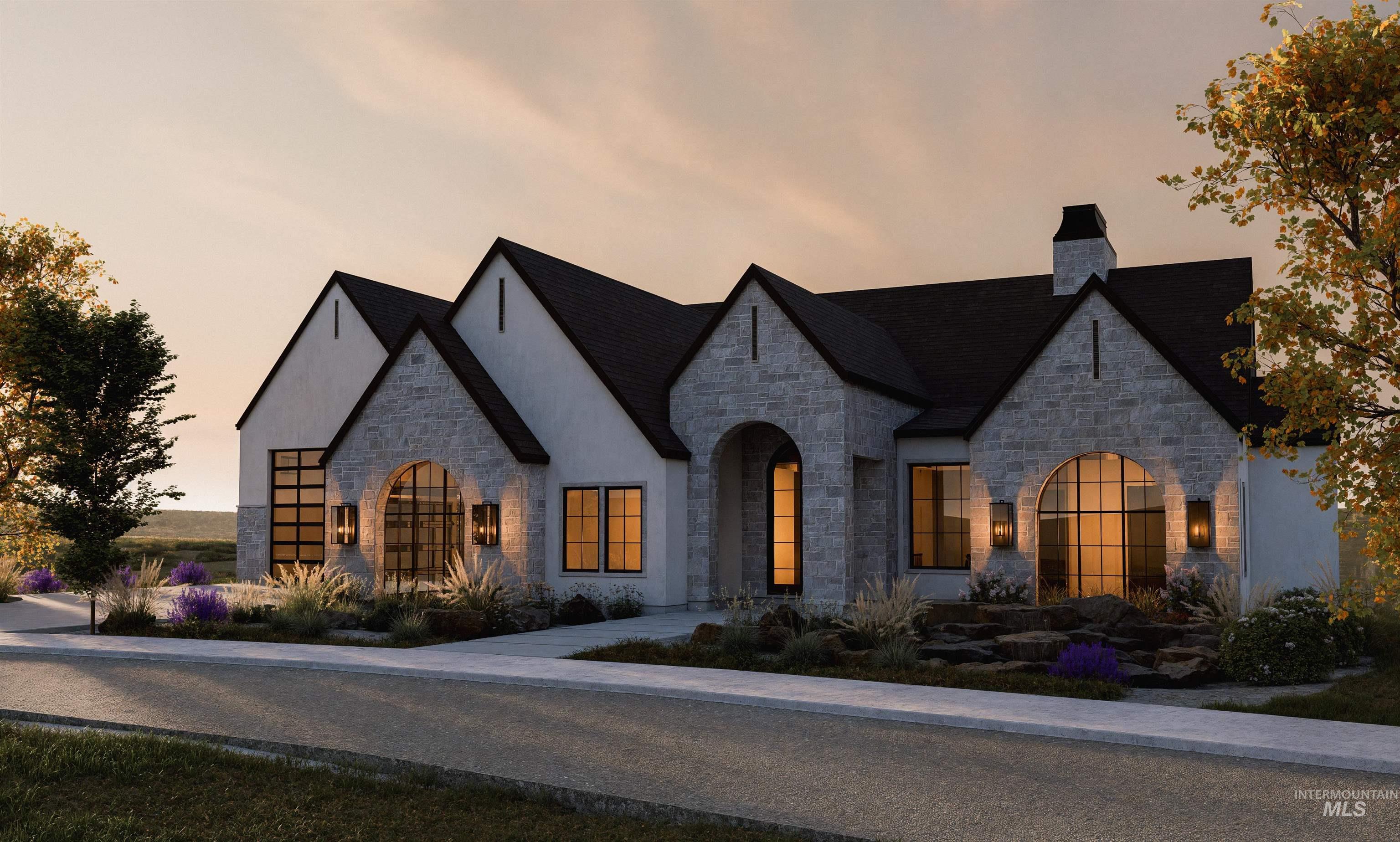 French country style house featuring stone siding, stucco siding, and a chimney