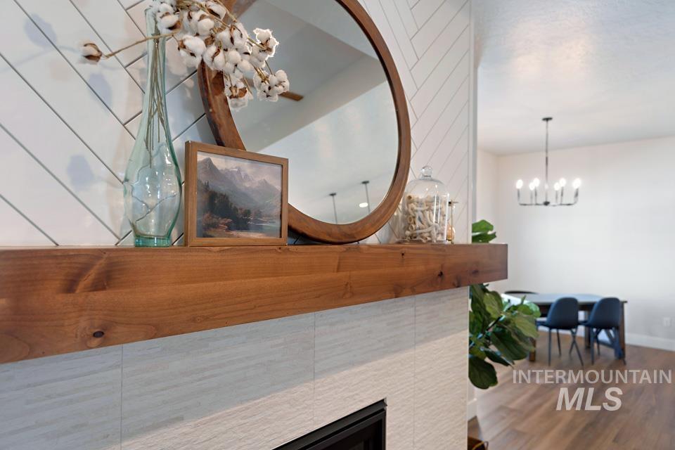Detailed view of a chandelier and wood finished floors