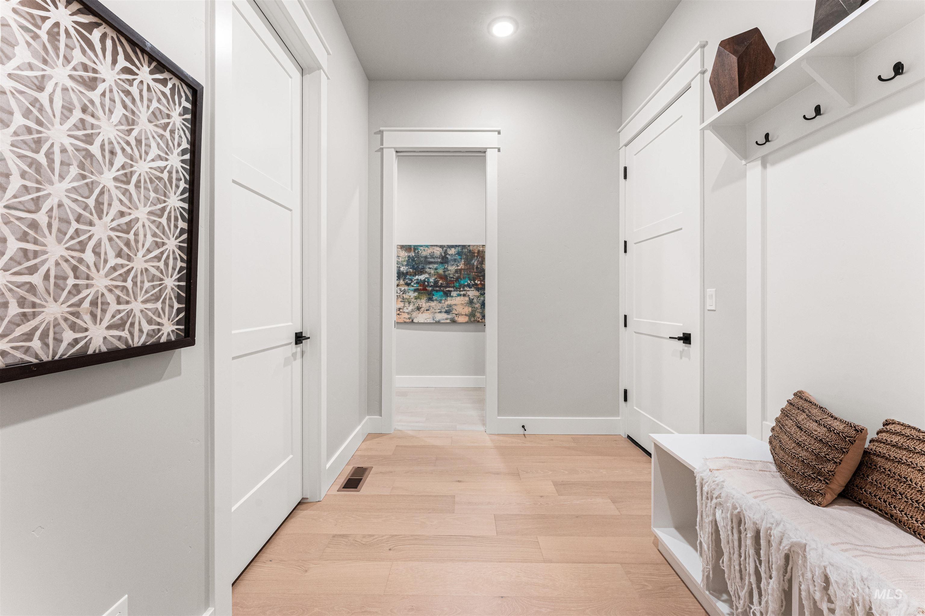Mudroom featuring light wood-style floors and recessed lighting