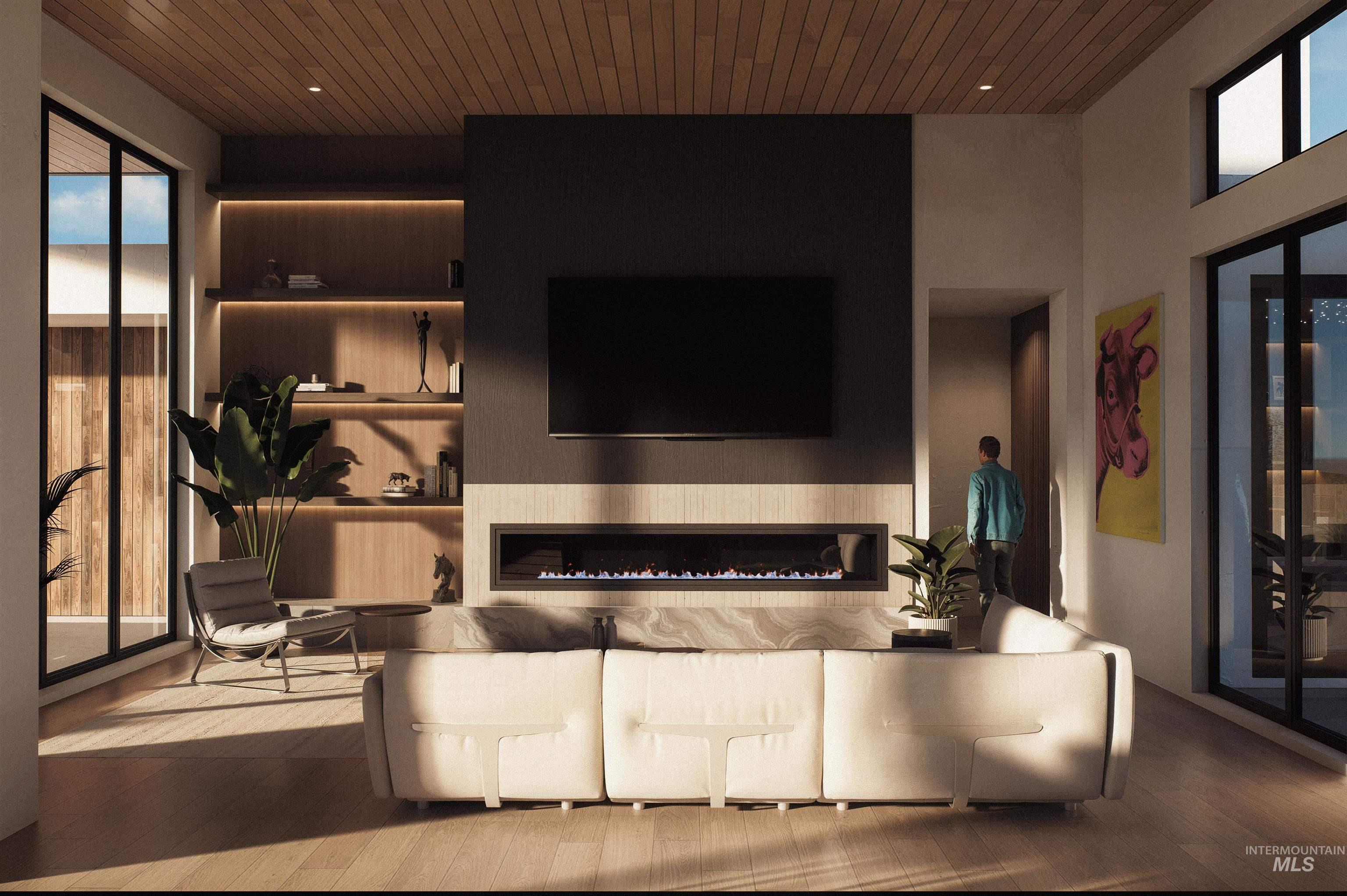 Living area with healthy amount of natural light, a glass covered fireplace, wood-type flooring, and wooden ceiling