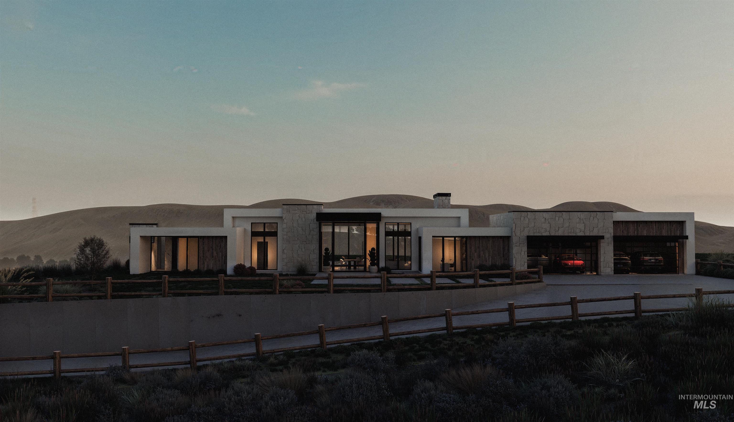 View of front of home with a fenced front yard, stucco siding, and a garage
