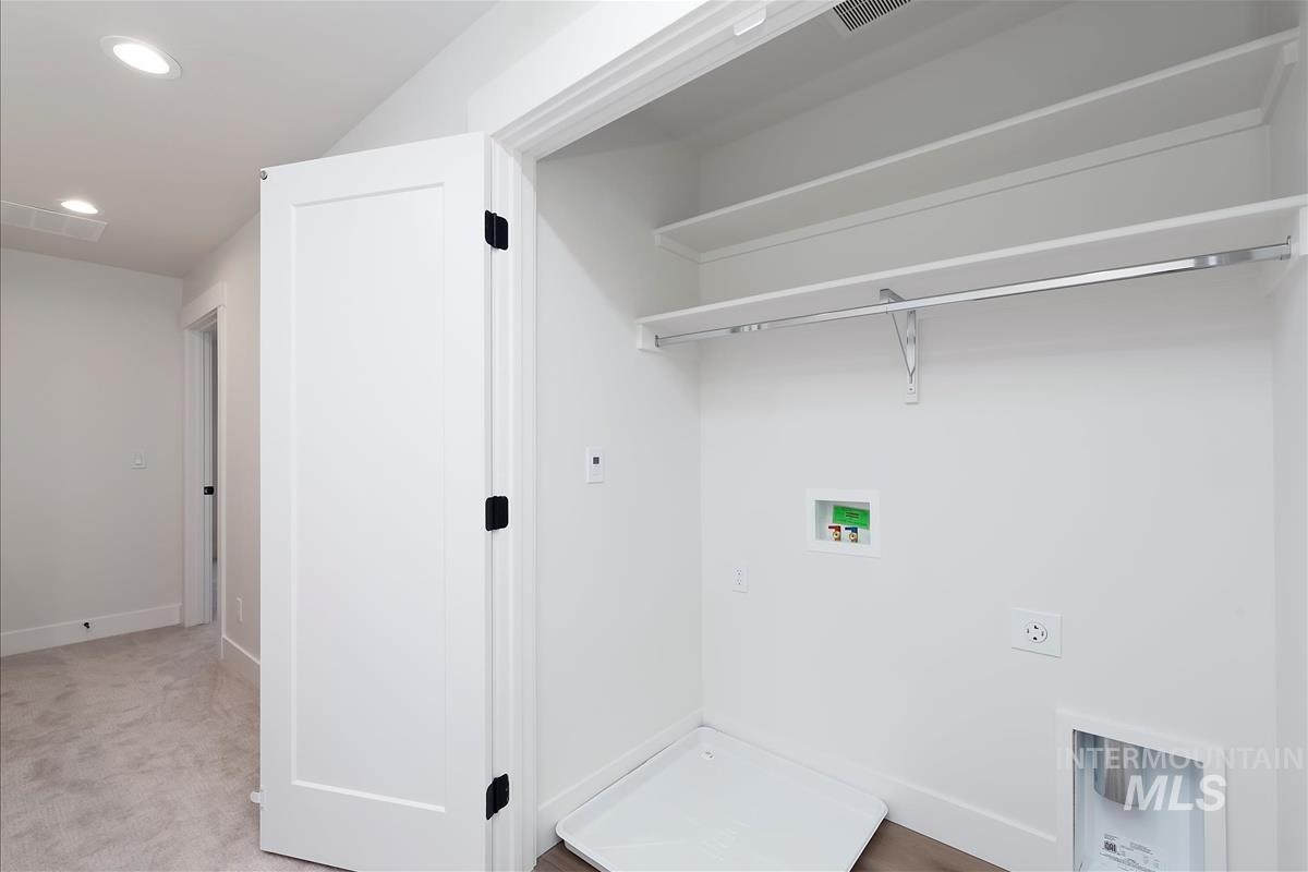 Laundry room featuring recessed lighting, hookup for a washing machine, carpet flooring, and hookup for an electric dryer