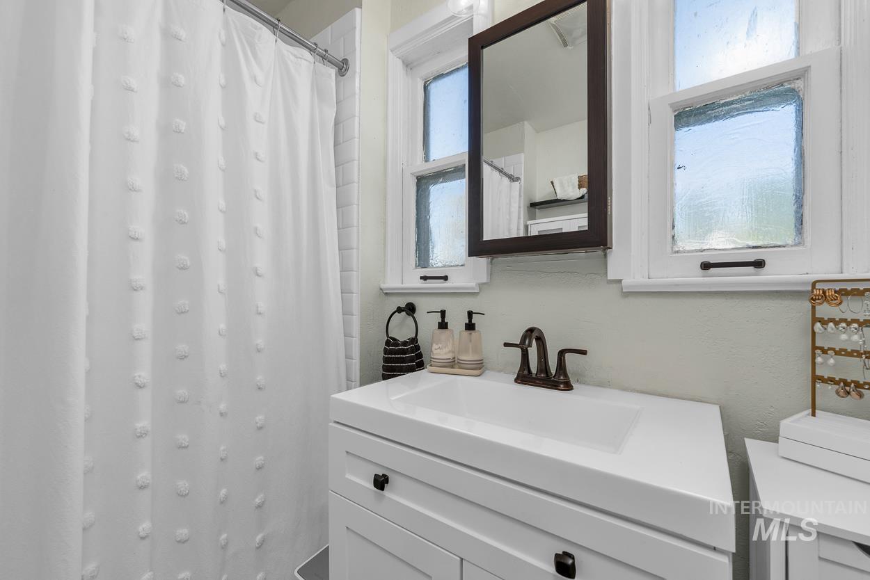 Bathroom with vanity and a shower with curtain