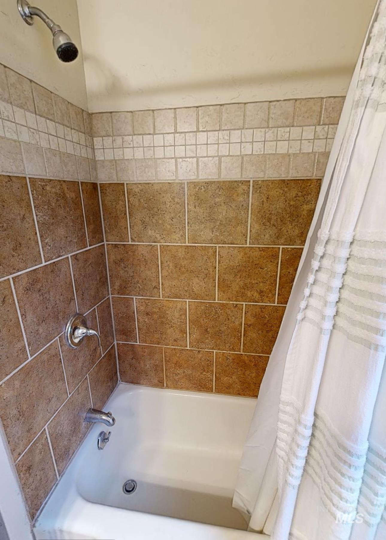 Full bathroom with shower / tub combo