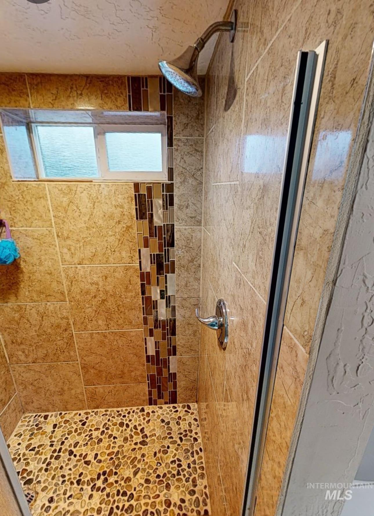 Bathroom with a stall shower