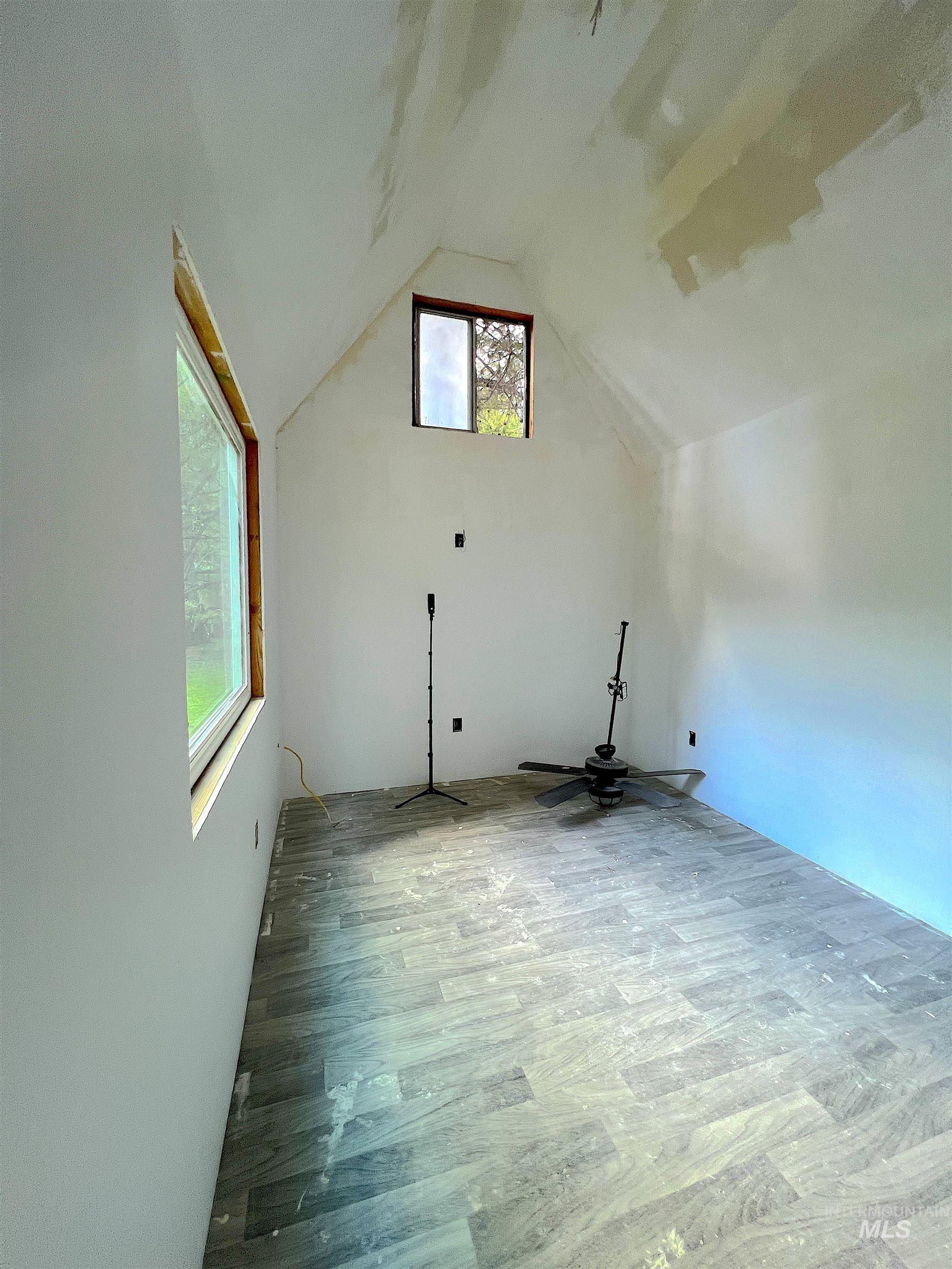Partially finished cabin w/ loft & wood finished floors