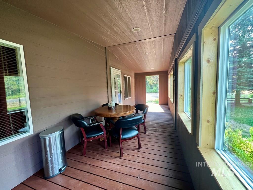 Sunroom / solarium featuring wood ceiling and hardwood / wood-style floors