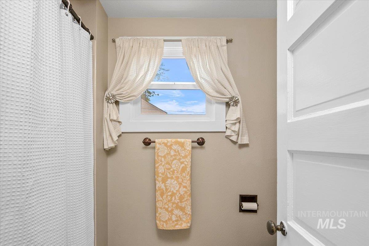 Bathroom with a shower with curtain