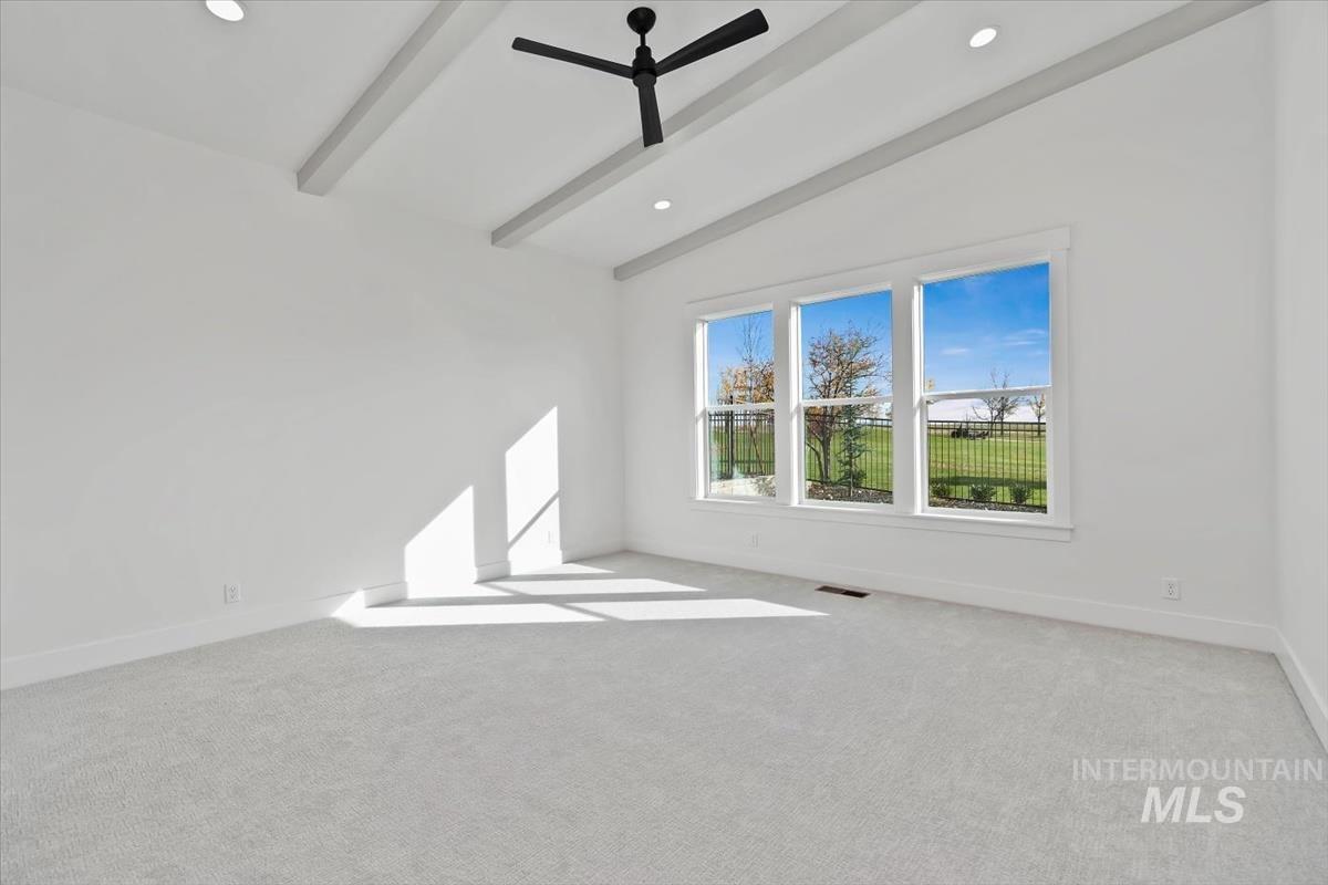 Empty room with light colored carpet, ceiling fan, and recessed lighting