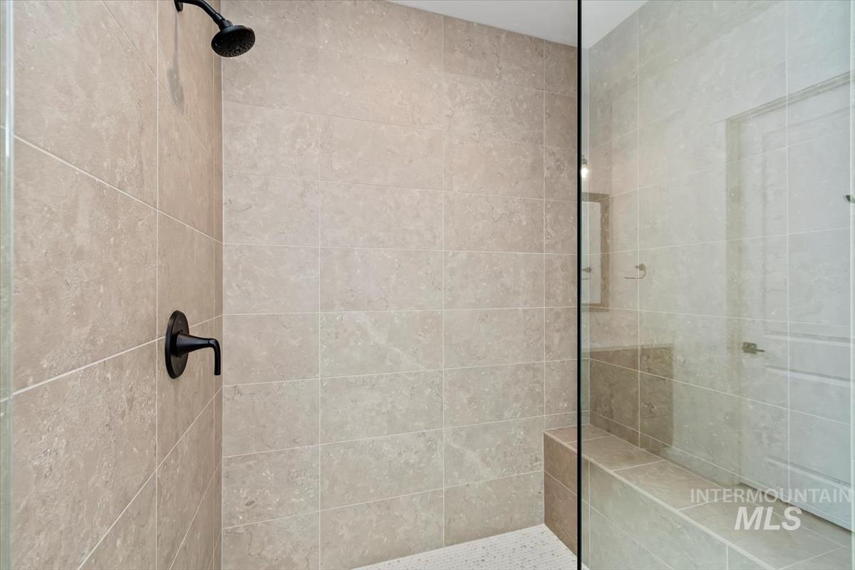 Full bath with a tile shower