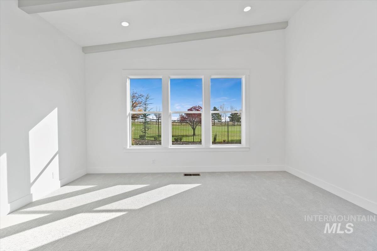 Unfurnished room with light carpet and recessed lighting