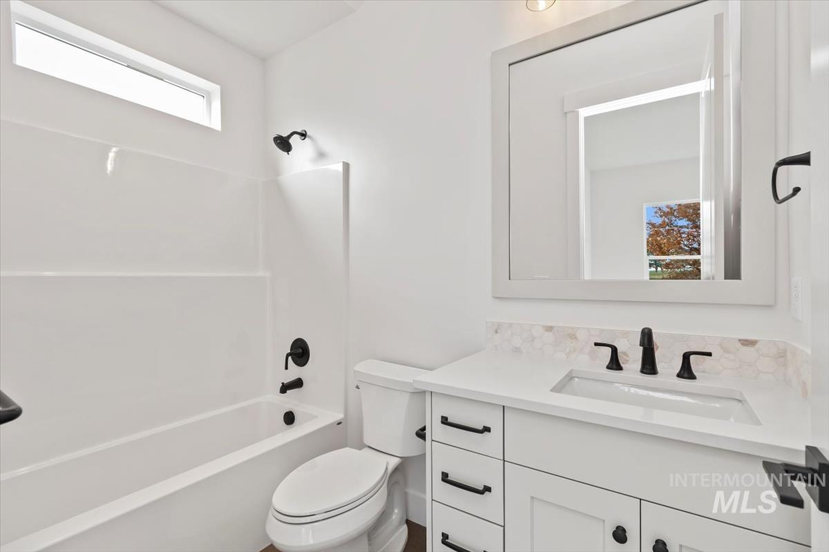 Full bath featuring bathing tub / shower combination and vanity