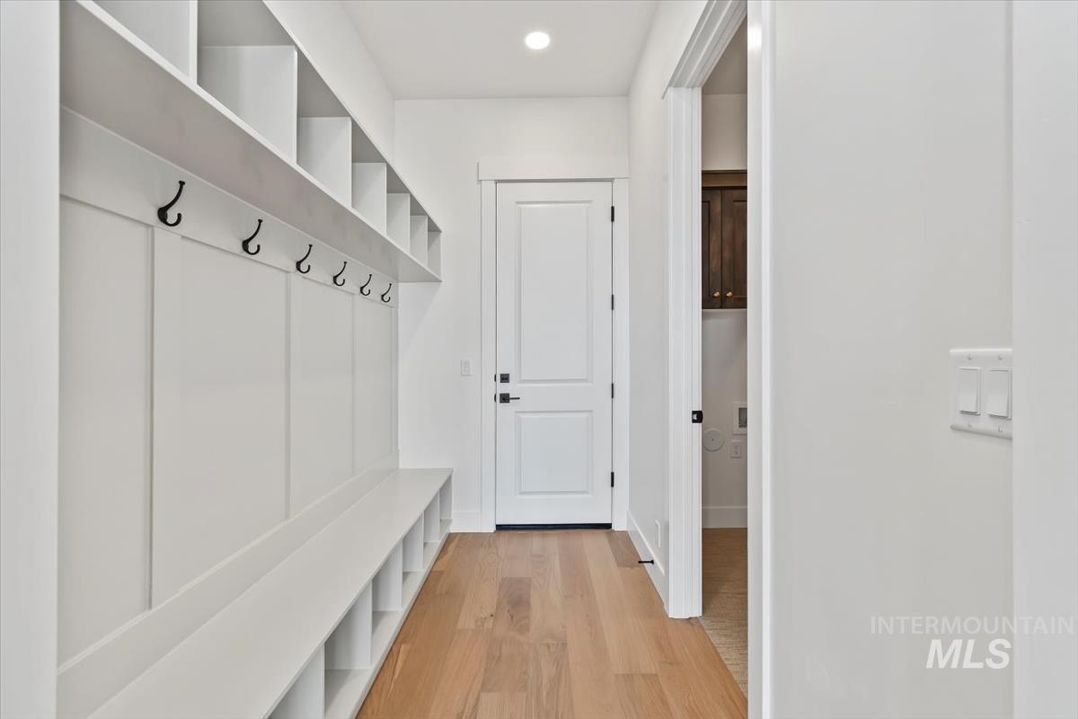 Mudroom featuring light wood-style floors and recessed lighting