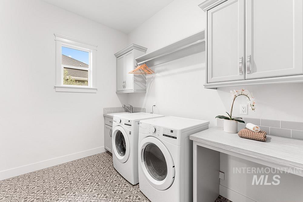 Laundry room with washer and dryer and cabinet space