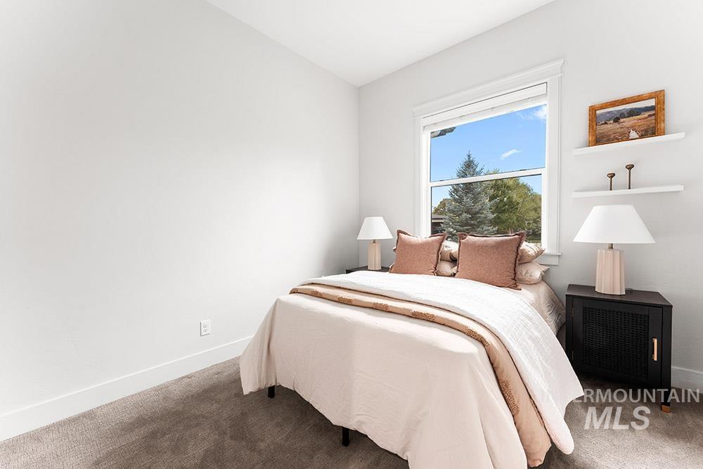 Bedroom with carpet and radiator