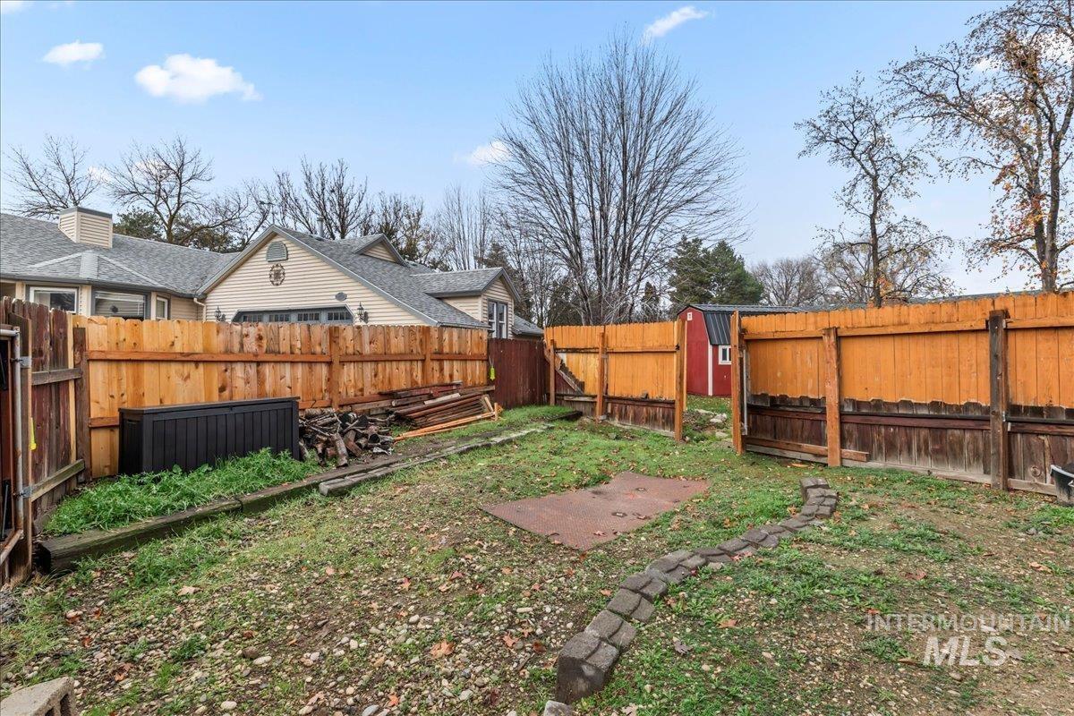 Fenced backyard with a gate