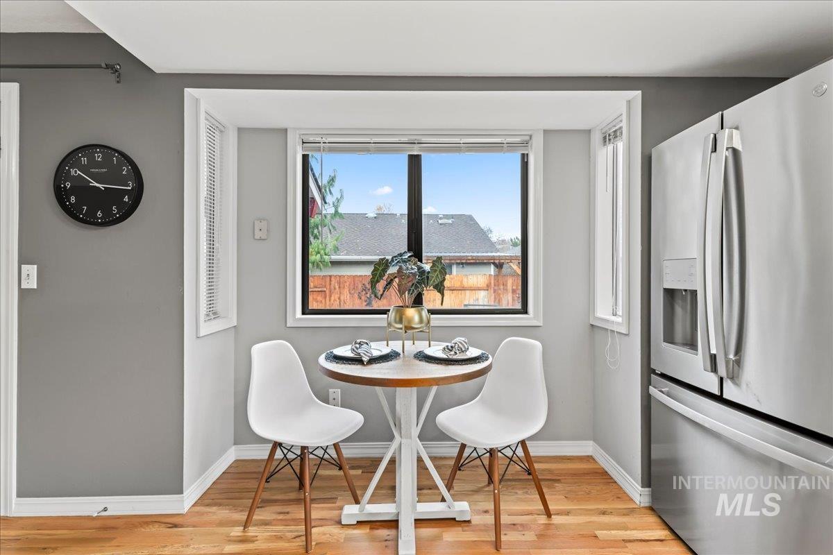 Dining area with light wood finished floors