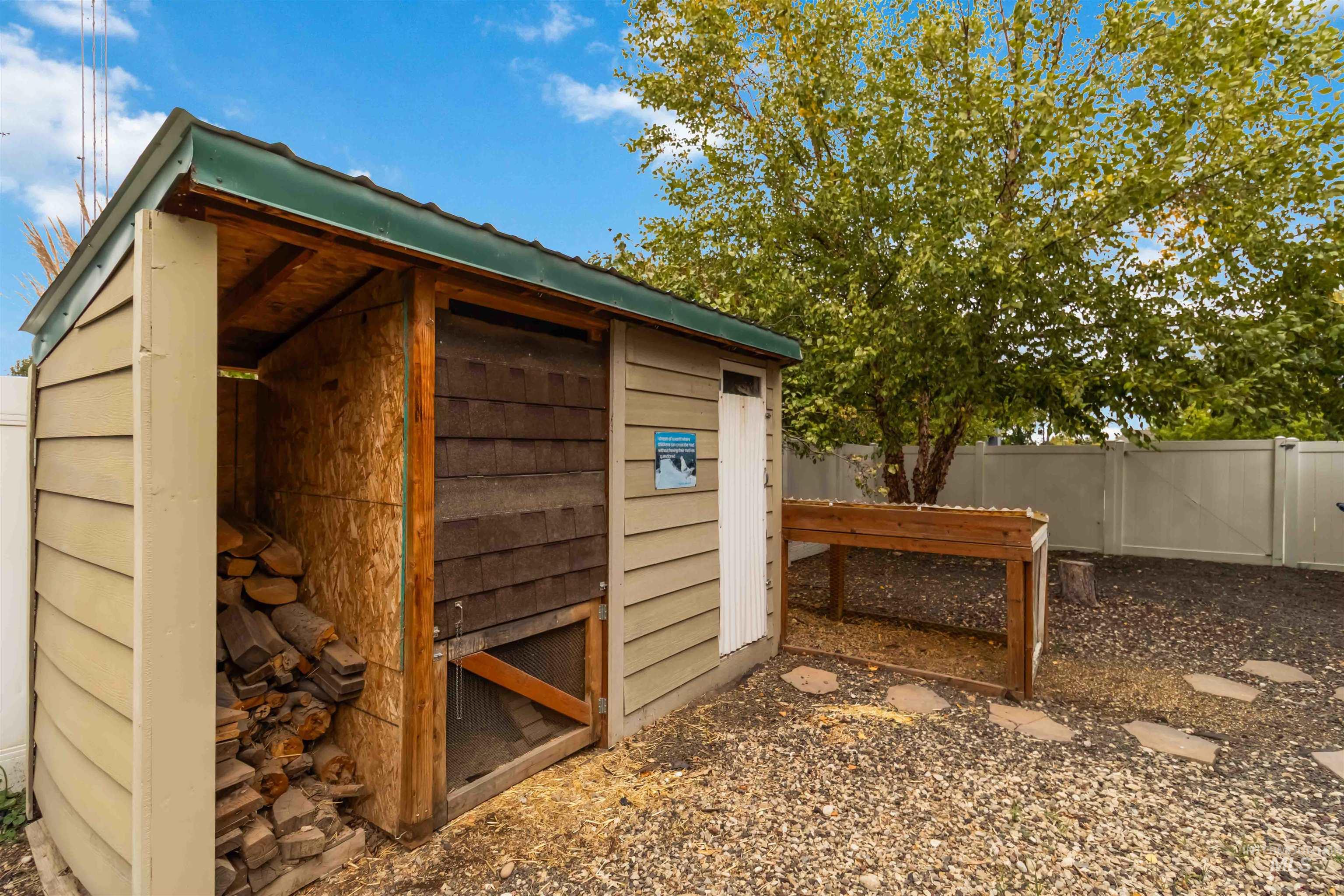 View of outdoor structure with a gate