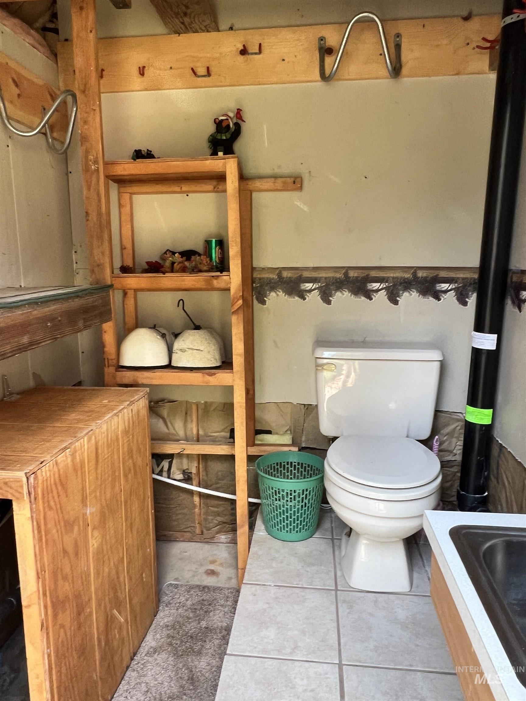 Bathroom featuring light tile patterned floors and tiled tub